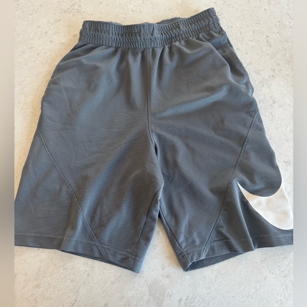 Nike Menโs Gray Athletic Shorts with White Swoosh